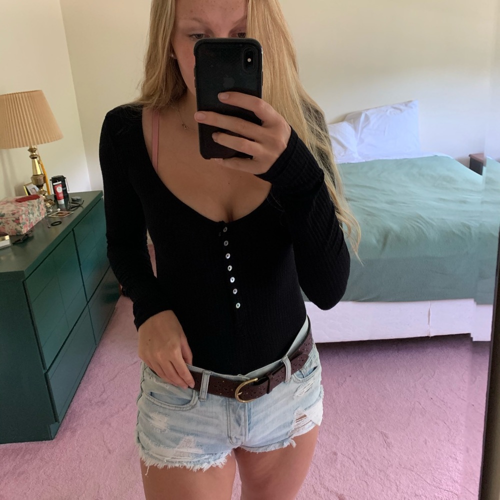 Black ribbed body suit. Low cut